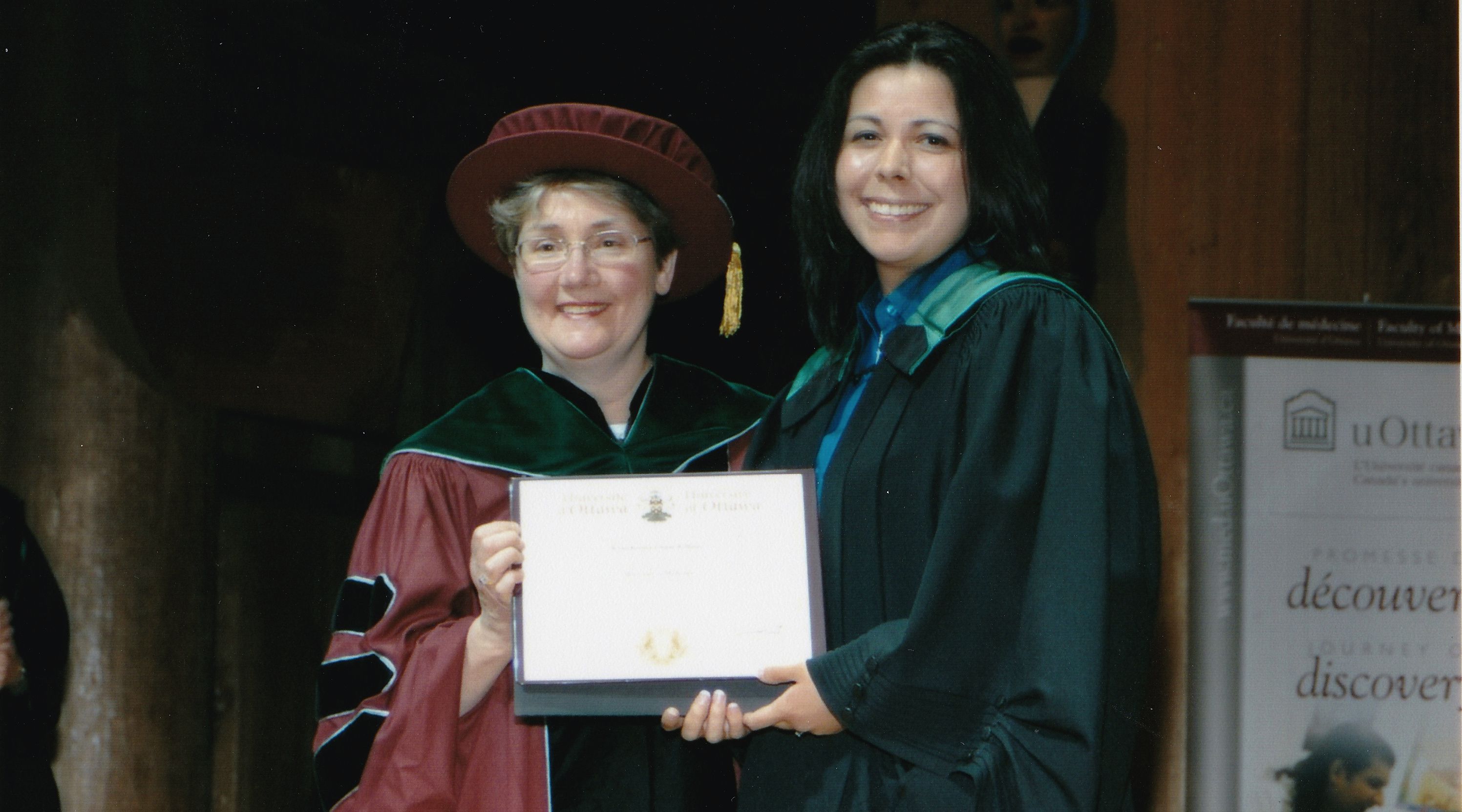 Photo of Kona Williams receiving her MD diploma from uOttawa professor Dr. Mary Senterman.
