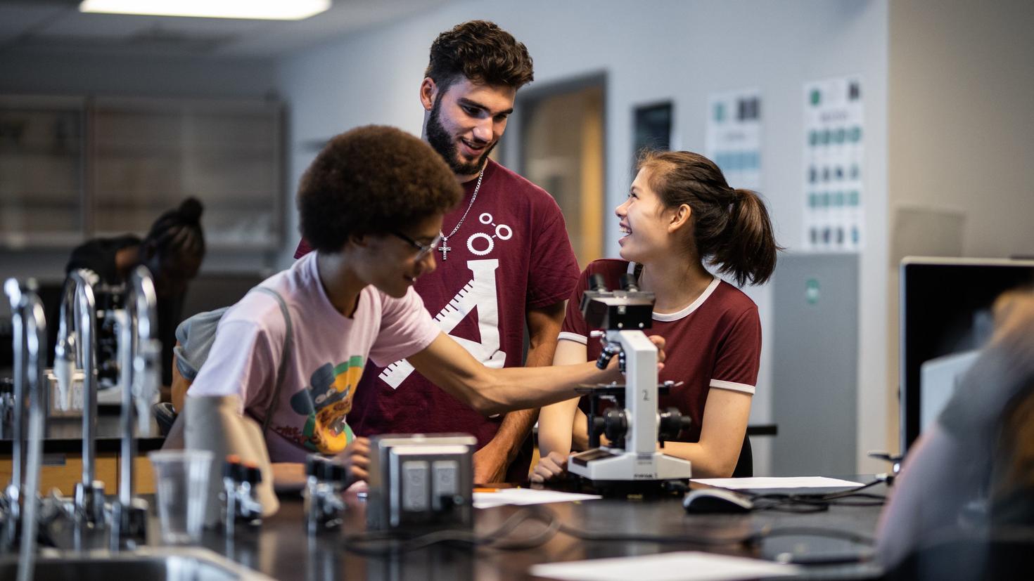 Instructor and students in lab.
