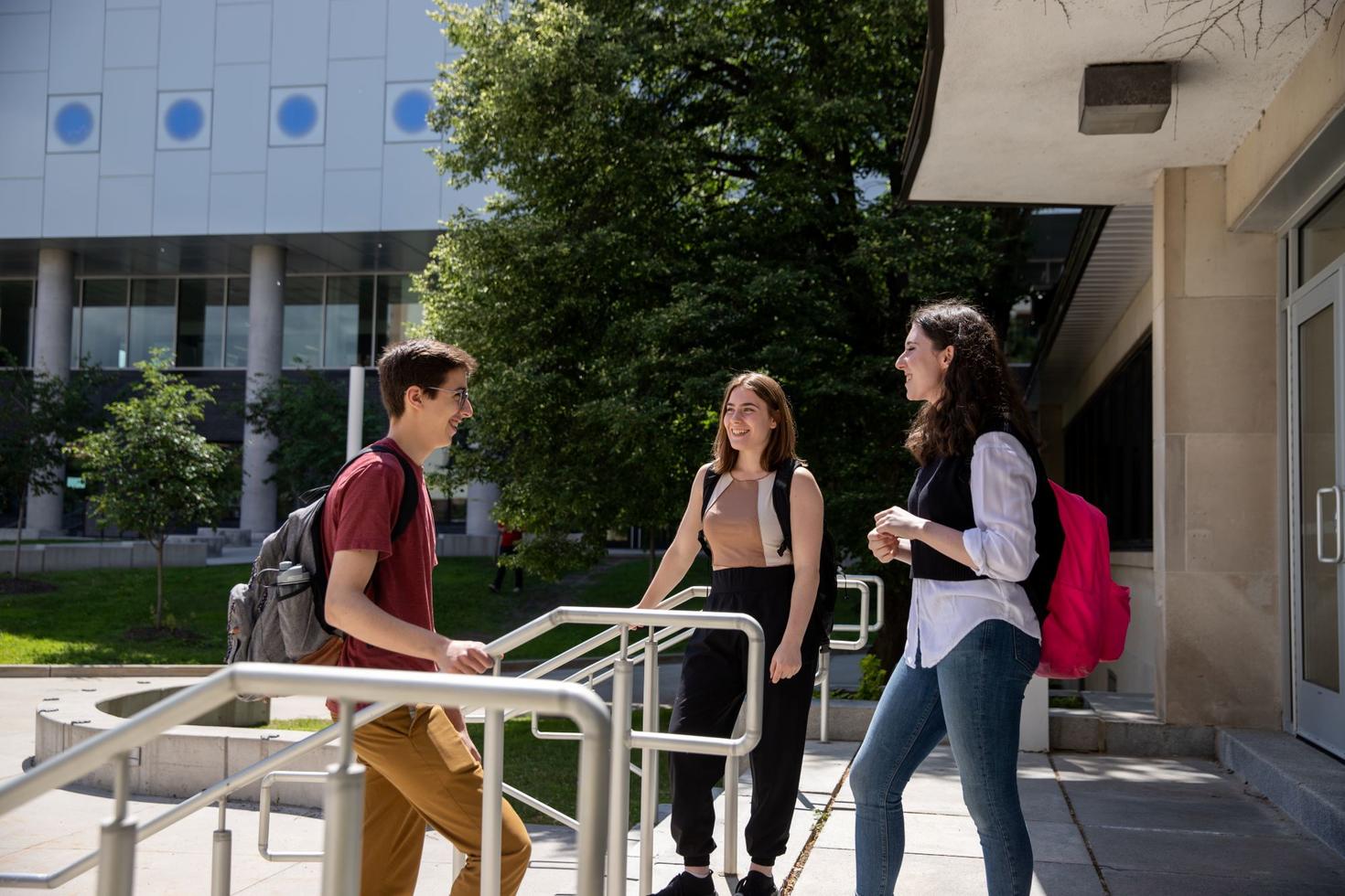 Students talking outside Marion Hall. 