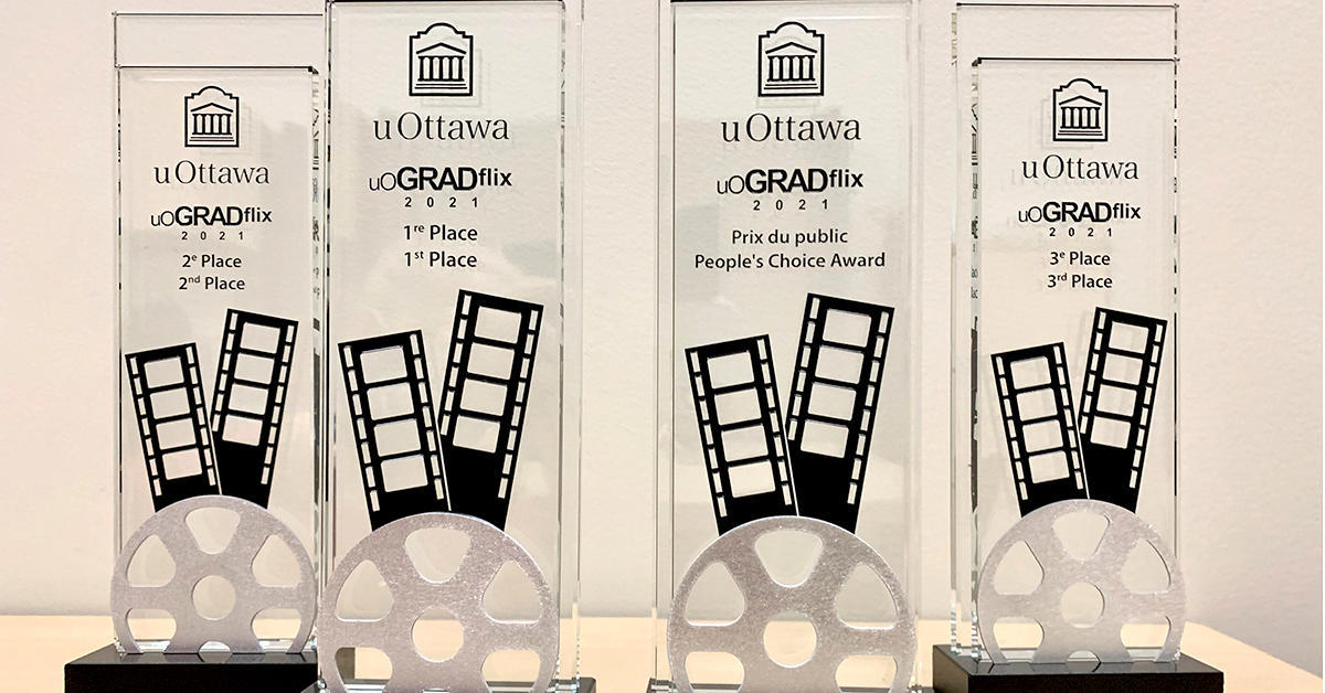 close up of four uogradflix awards placed on a table