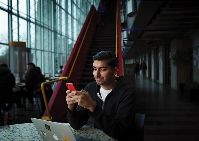 Student looking at phone.
