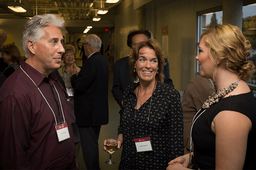 People discussing at a donor event.