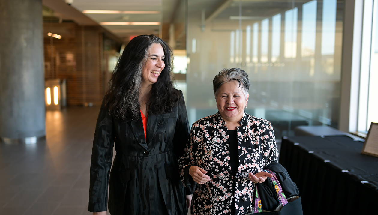 Chancellor of the University of Ottawa Claudette Commanda walking with Tanya Talaga.