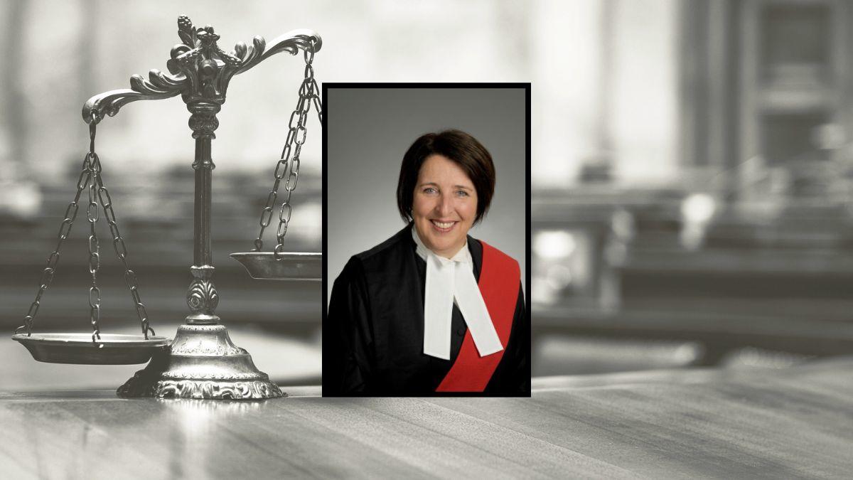 Portrait of female judge with legal scale background