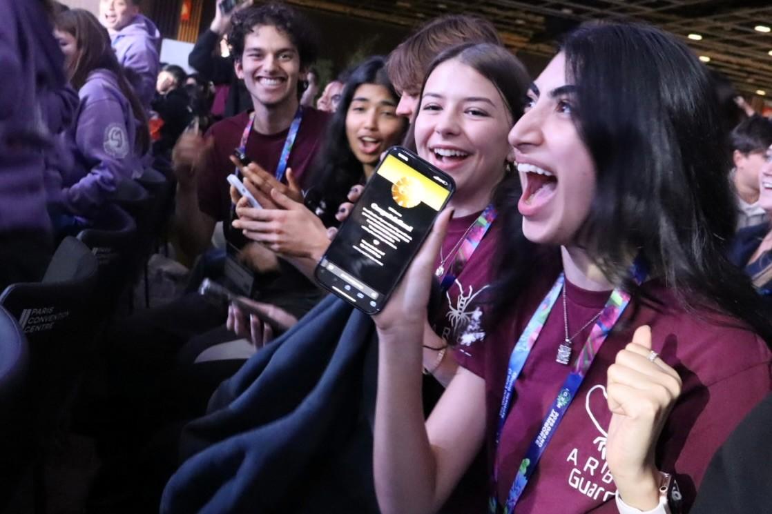 The iGEM team cheers with joy after winning the competition.