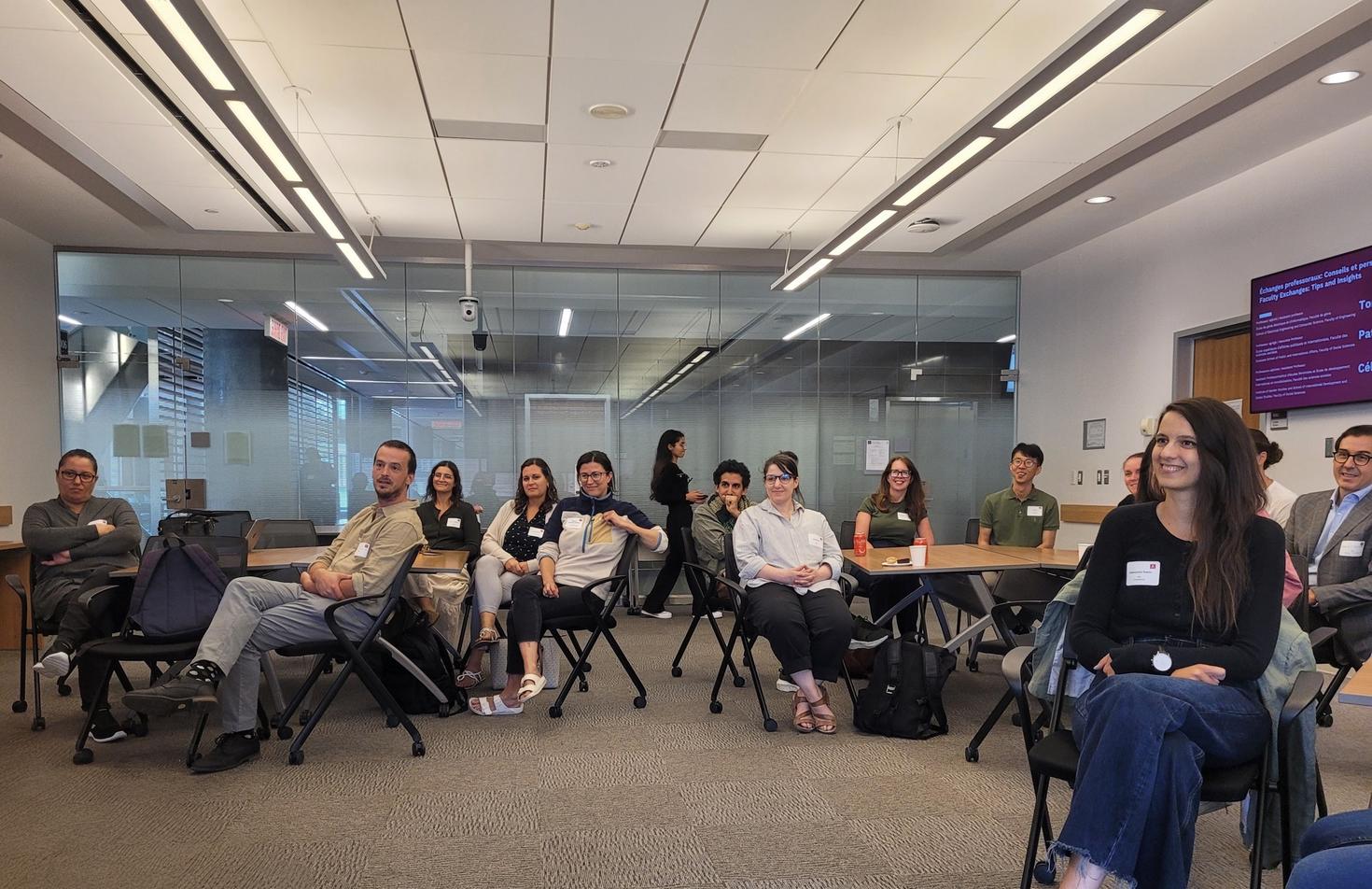 Group of new uOttawa professors sitting down in a classroom 