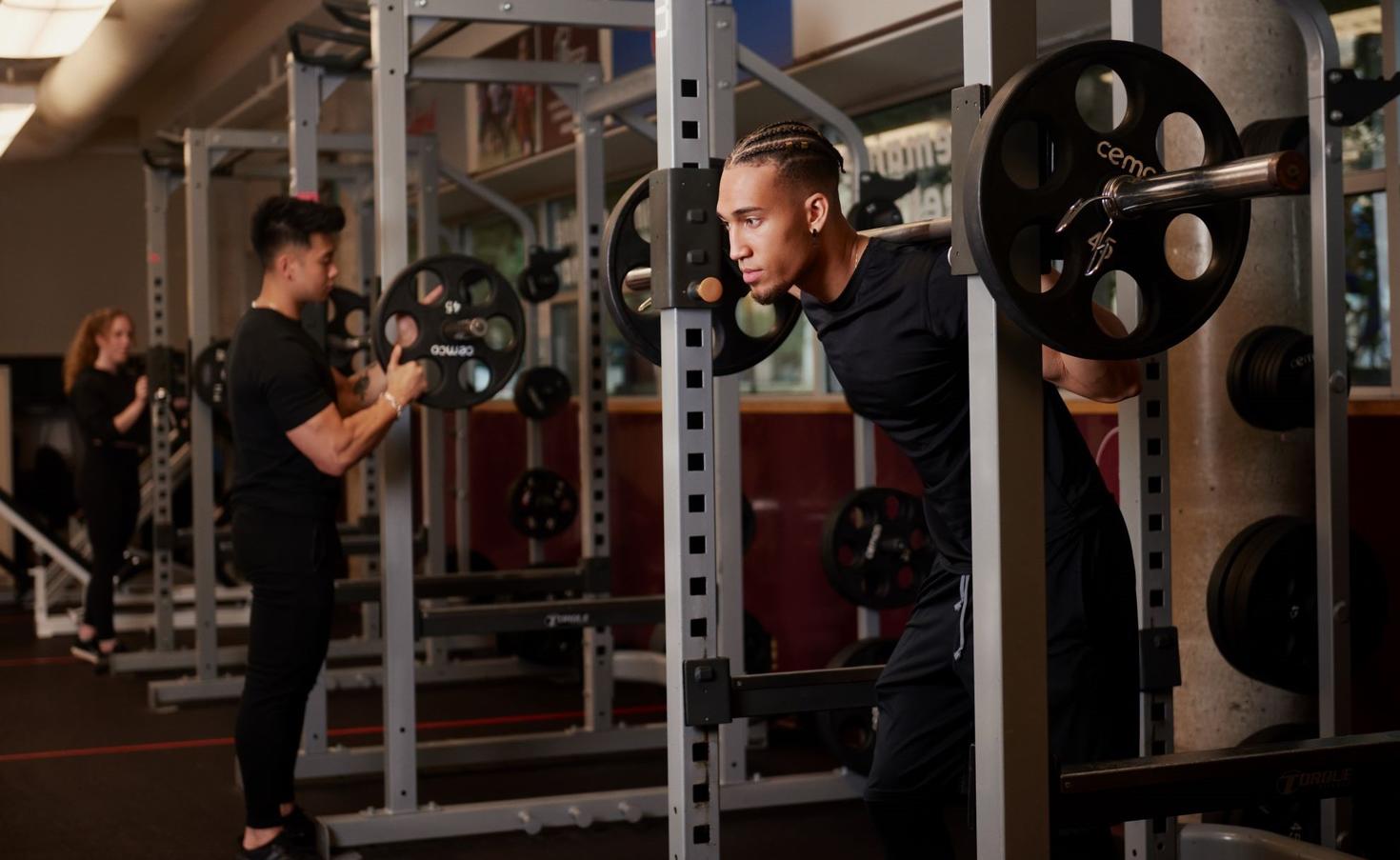 A student lifting weights.