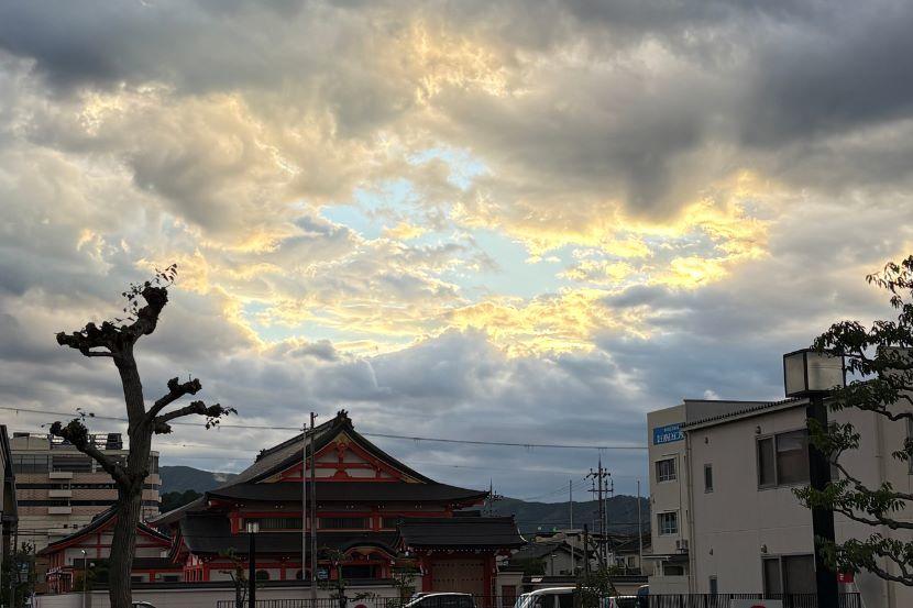 The sun begins to set over buildings in Japan.