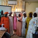 Group of 9 women including 8 wearing traditional clothes called "boubous"