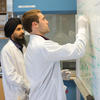 students writing on white board