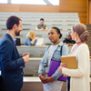 Students speaking with a professor