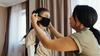 Mother helping child with her mask