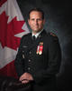 Dr. Maxime Britt-Côté seated and dressed in a Canadian Army uniform