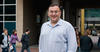 Portrait of Alain St Amant standing in front of biosciences building