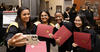 happy students taking a selfie with their new diplomas