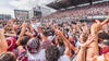 Gee-Gees celebrating on field after 2023 Panda Game victory.