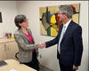 Marie-Eve Sylvestre, dean of the Faculty of Law, Civil Law Section, shakes hands with Jean-Marc Thouvenin, Secretary General of The Hague Academy of International Law.