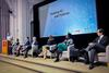 Academics from around the globe discussing AI legislation in a panel.