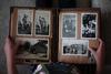 Person looking at black and white photos in an album