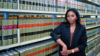 Julie Ada stands in front of shelves of legal books in a library