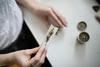Woman rolling a cannabis joint