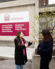 Two students talking in front of Academic Writing Help Centre