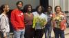 Senator Bernadette Clément (right) and clinical psychology doctoral candidates Wina Darius and Grace Jacob (centre) pose with three high school students.
