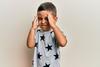 Boy holding his head due to pain