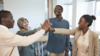 Students doing a group high-five