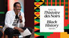 Awad Ibrahim, speaking into a microphone at an event, with a Black History Month graphic beside him.
