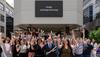 Inauguration of the Arts District at the University of Ottawa with outgoing dean Kevin Kee, joined by dignitaries, Faculty of Arts staff, and local artists, in front of the sign “Endaji adisibigenàniwang”.