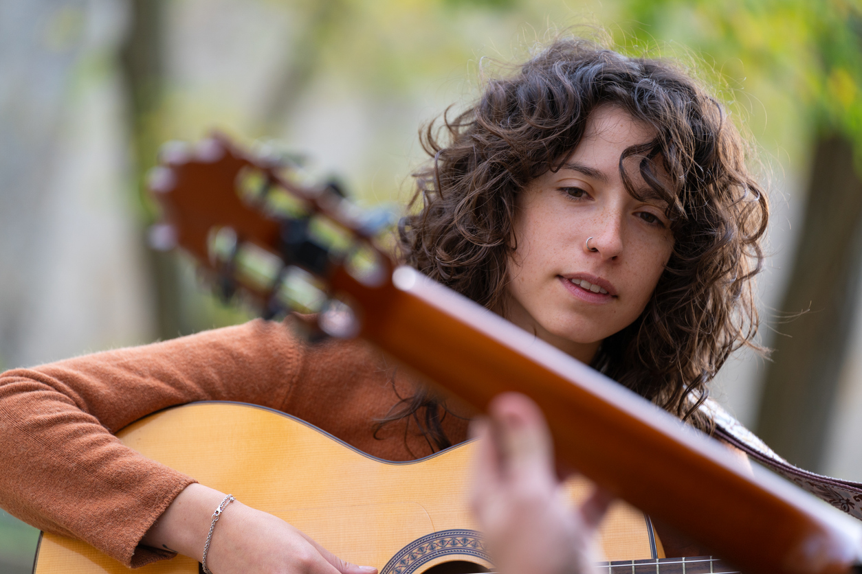 High school student playing guitar