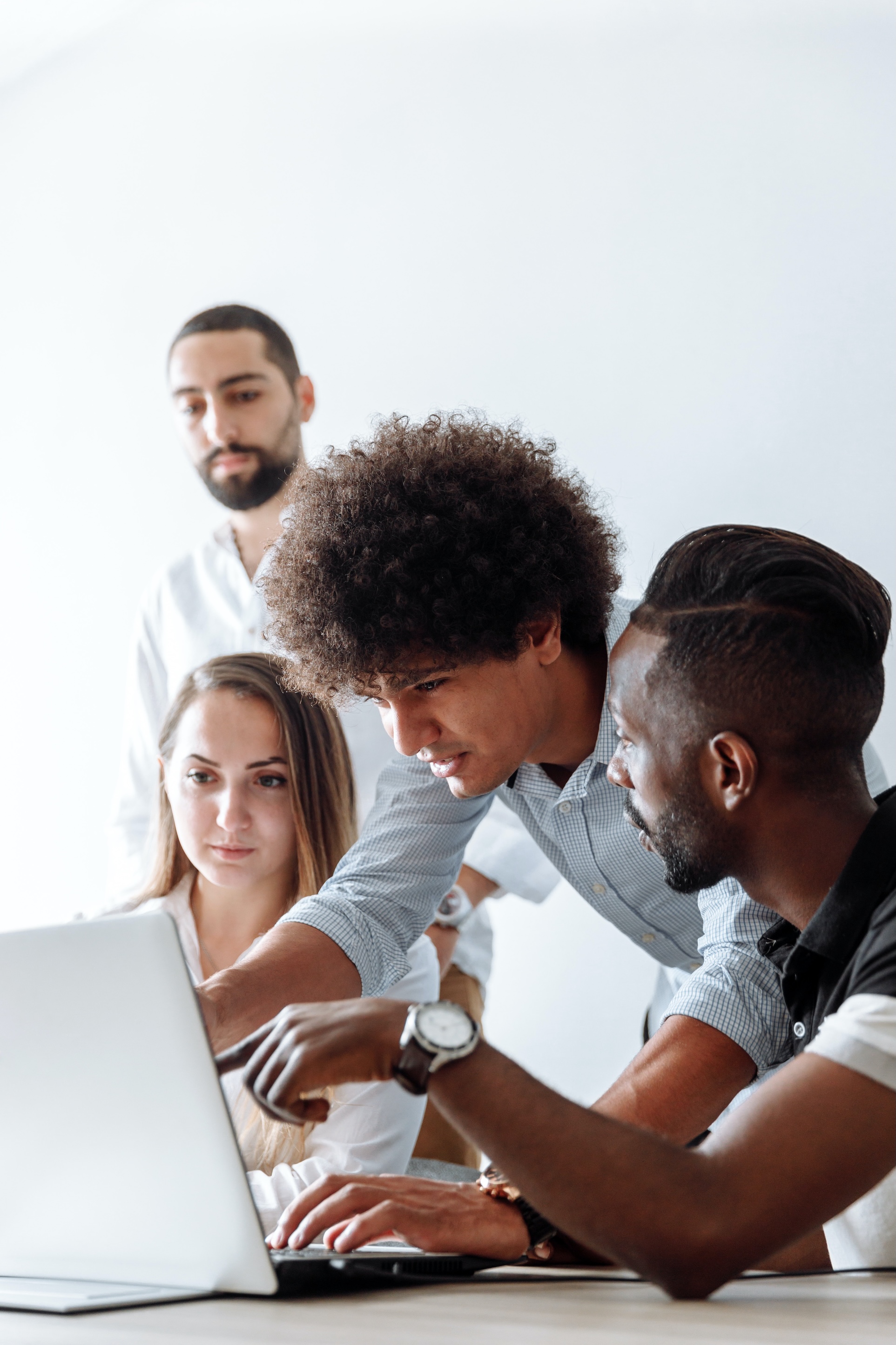 Group of people working on a laptop