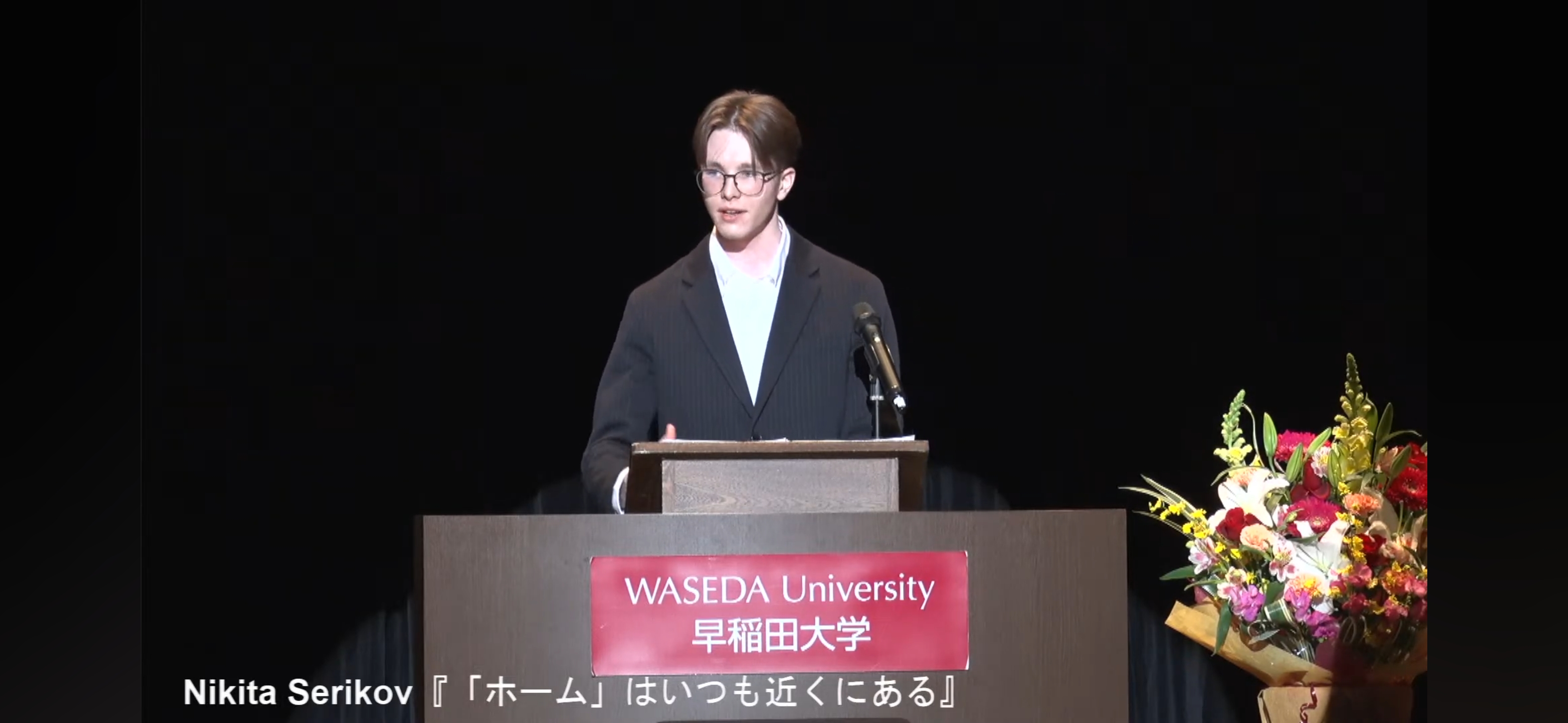 Student speaking at a podium