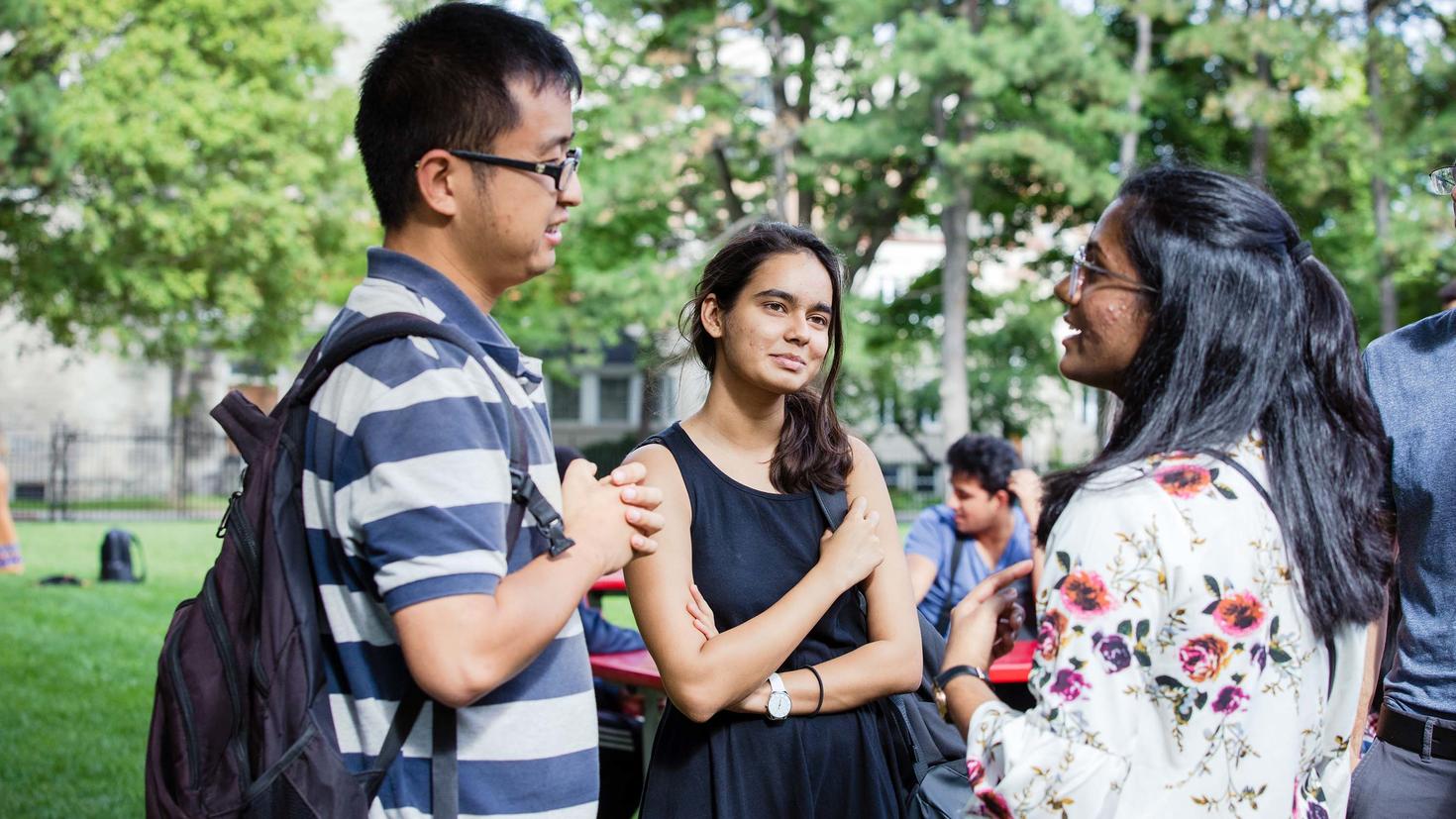 students discussing outside