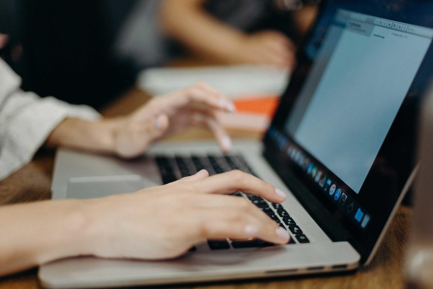 person typing on computer