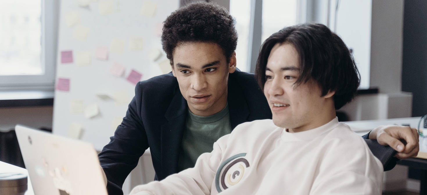 students looking at the computer