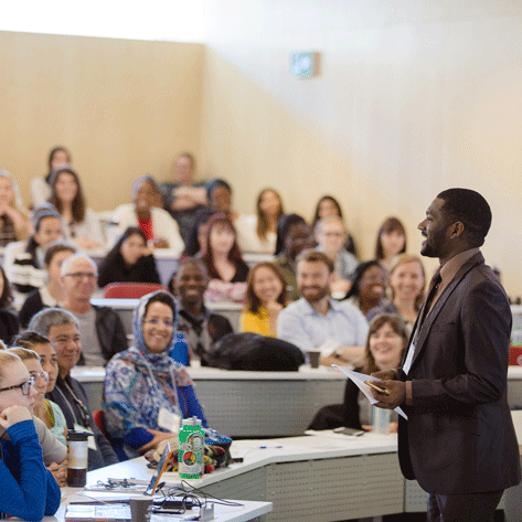 Professor in a classroom full of students