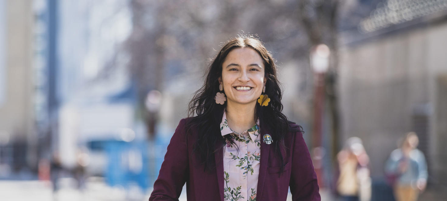 indigenous student smiling at camera