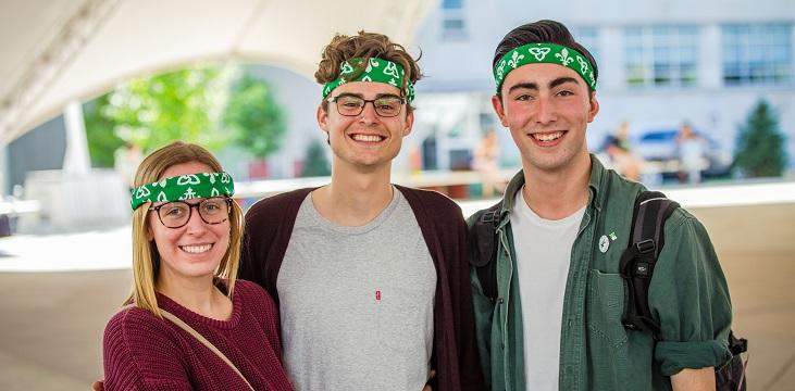 Three students with franco-ontariens bandanas.