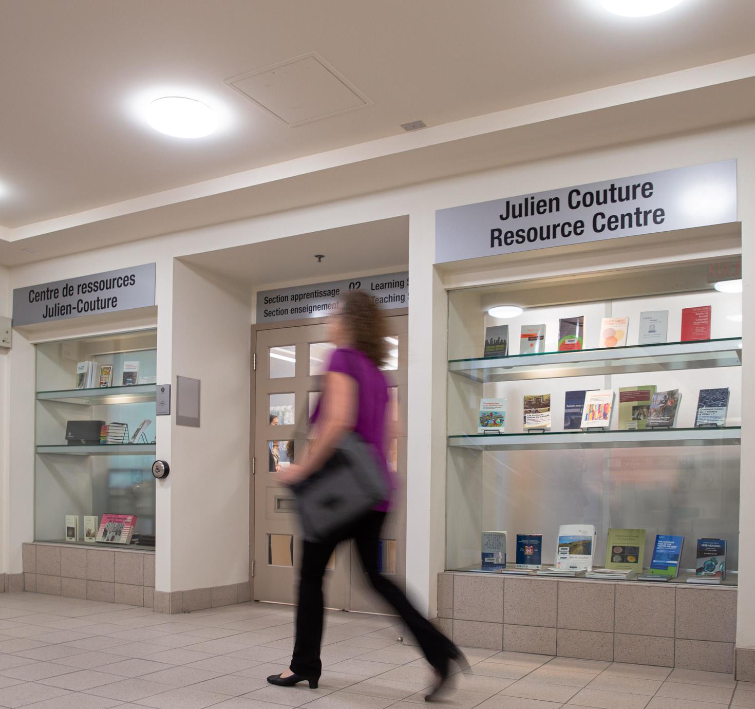 Person walking in front of the Julien Couture Resource Centre (JCRC).
