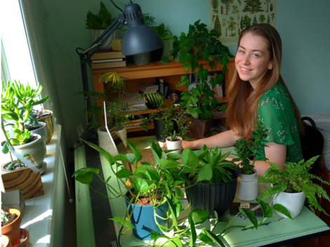 Student taking care of plants