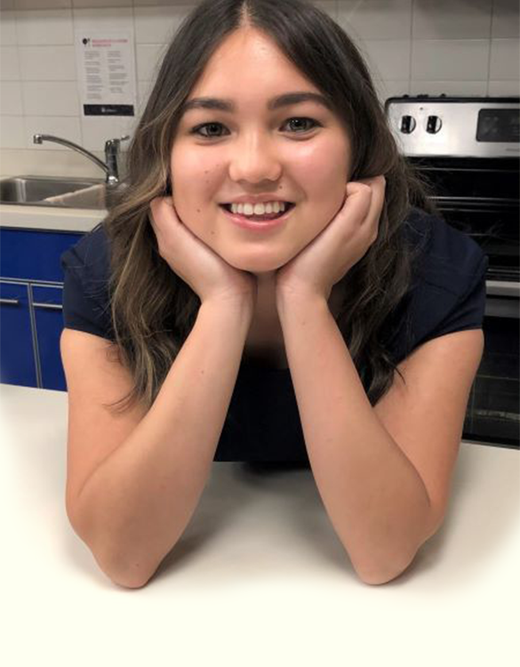 Student smiling at the camera