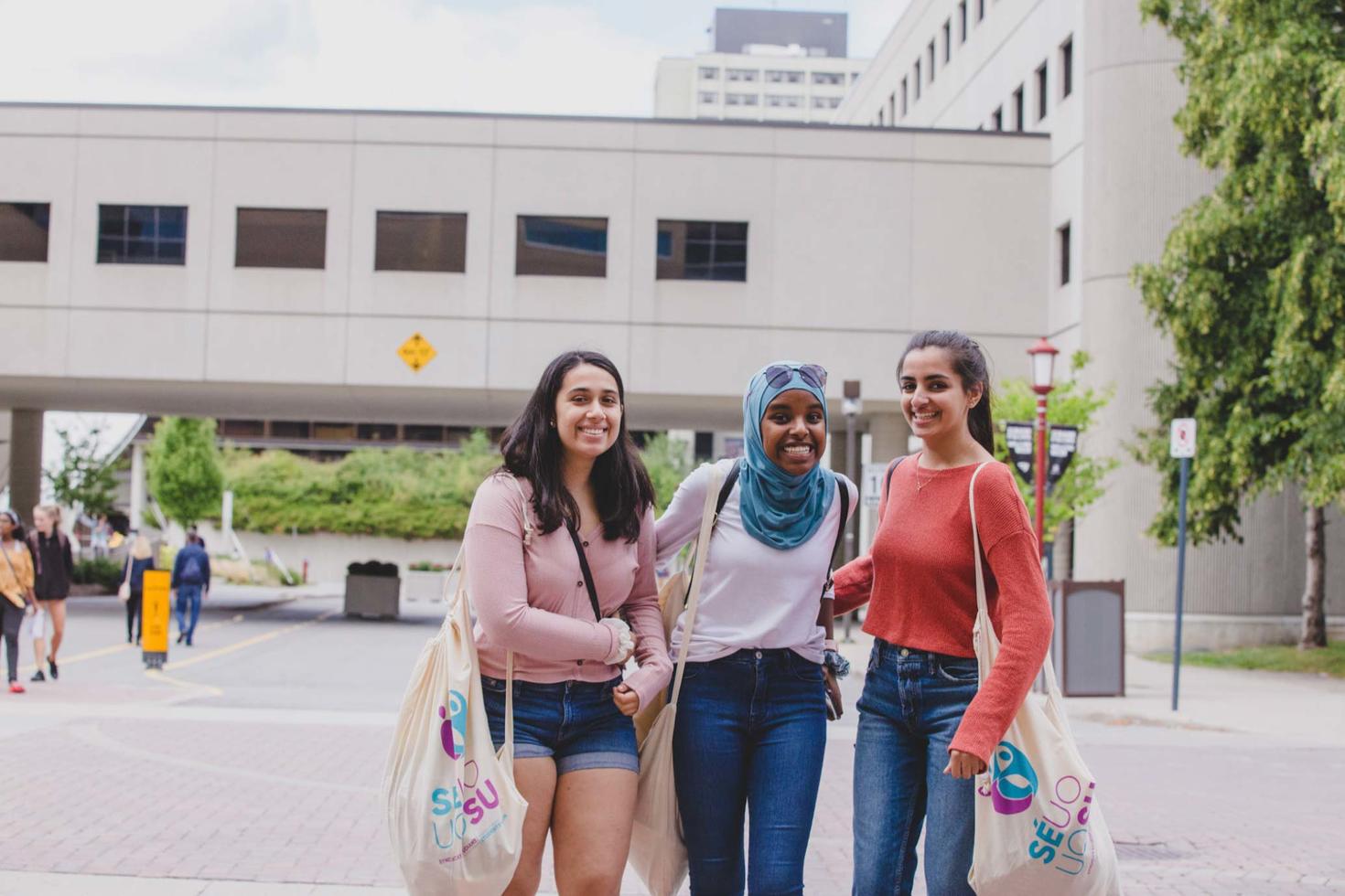 students standing outside on campus