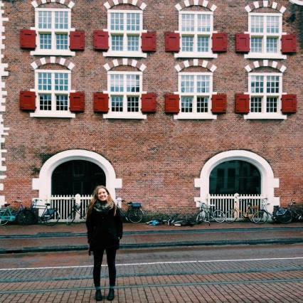 student in front a building in The Hague, Netherlands