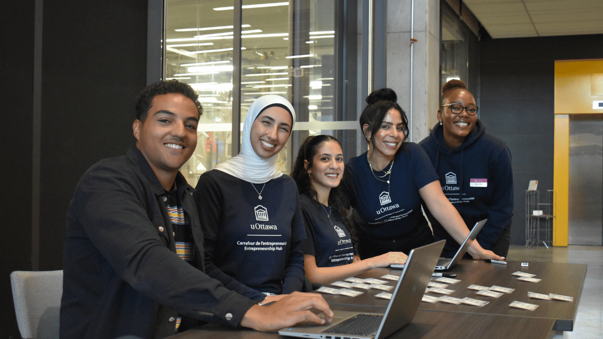 Students taking registration at an event