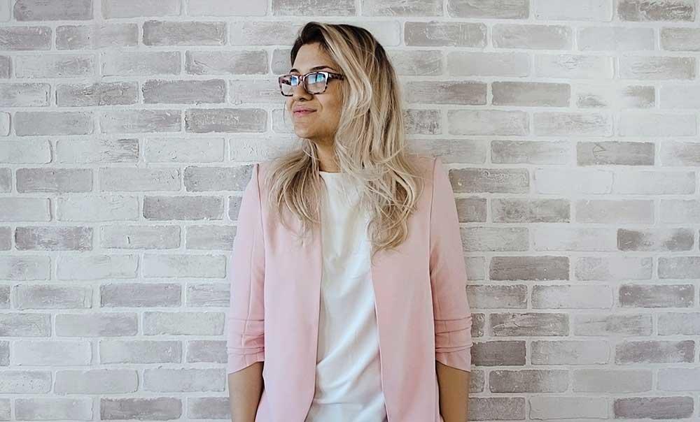 girl leaning against wall
