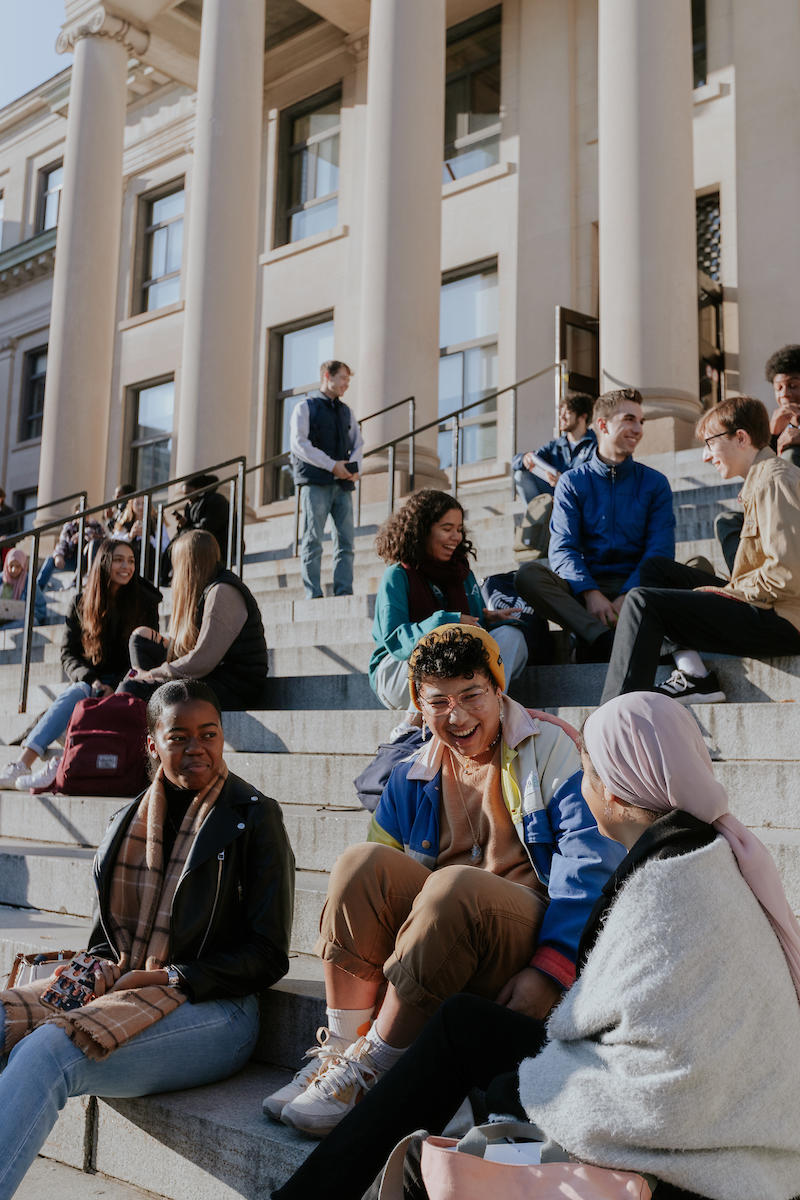 Group of students on the steps of Tabaret hall 