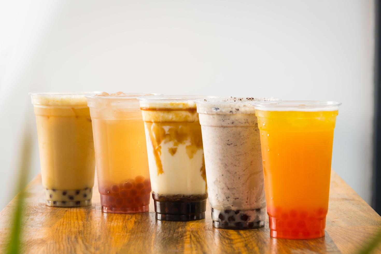 Five glasses of boba tea on a table