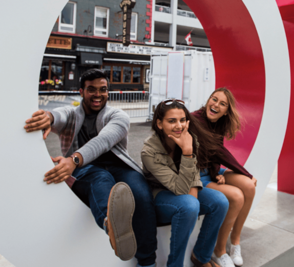 Students at the Ottawa sign in the Byward Market